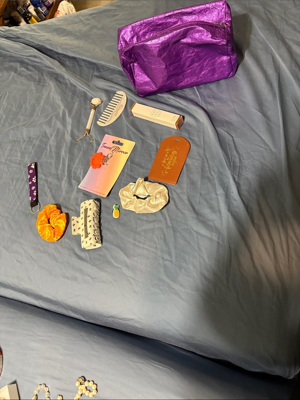 Assorted Hair Accessory Set in Orange, Cream and in purple Clique make up bag
